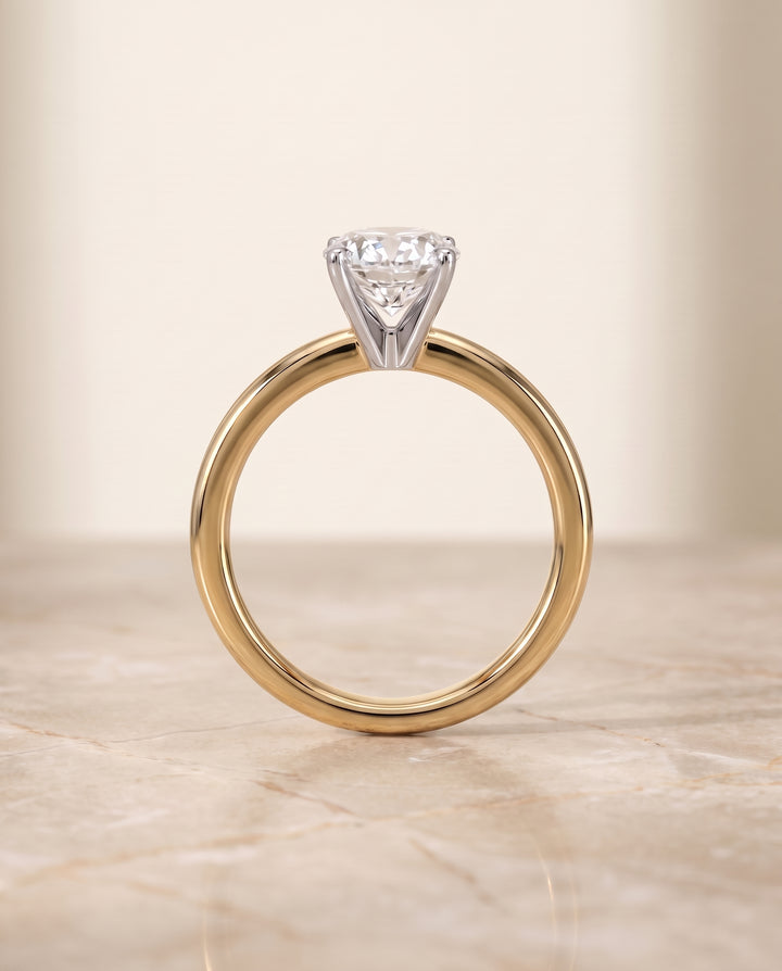 The Floria Comfort Fit Claw Prong Solitaire Oval Engagement Ring Setting in 18K Yellow Gold