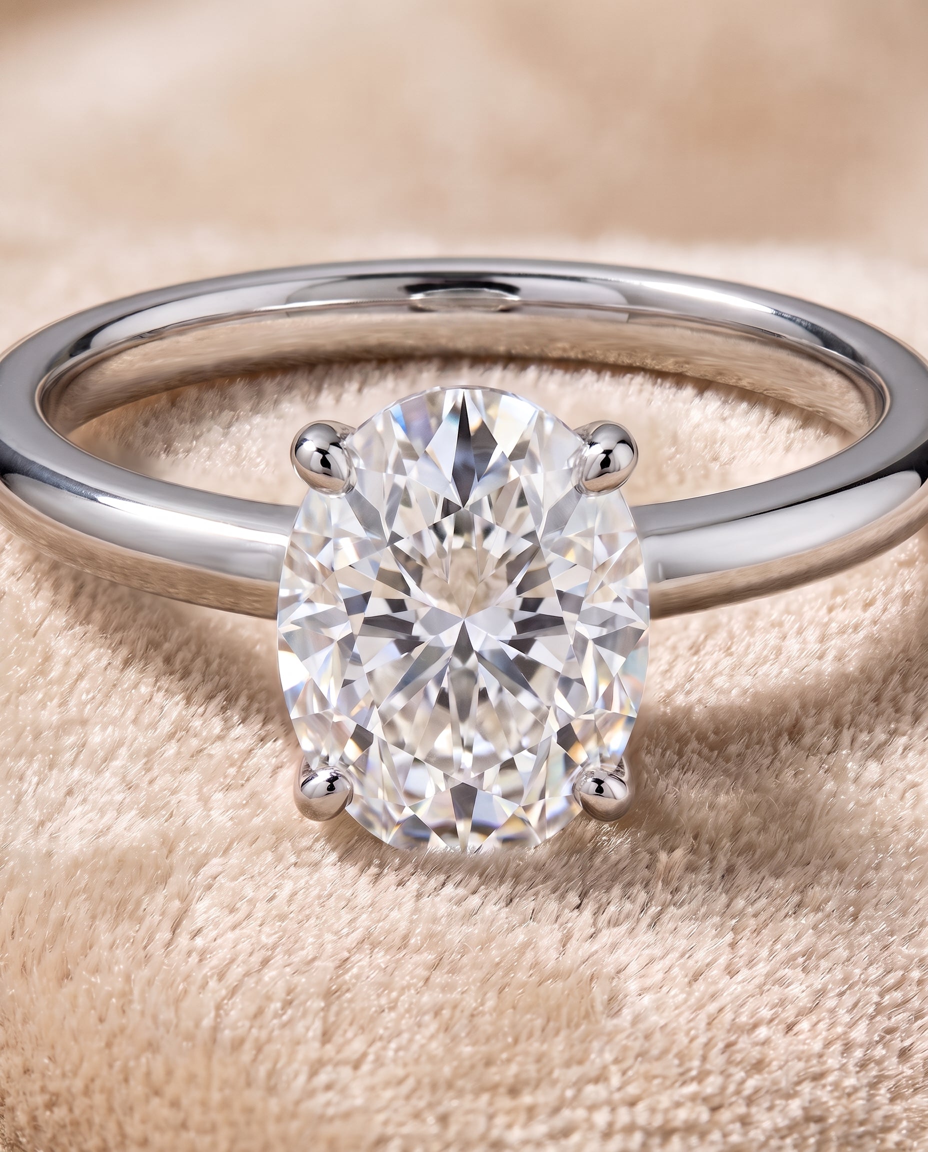 The Floria Comfort Fit Claw Prong Solitaire Oval Engagement Ring Setting in Platinum