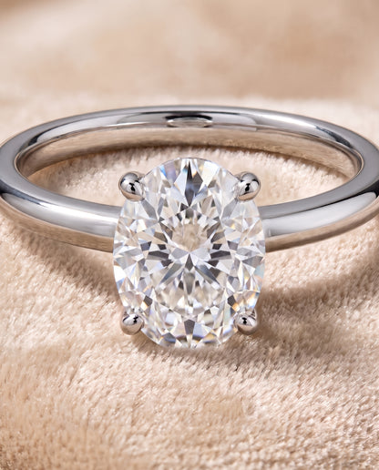 The Floria Comfort Fit Claw Prong Solitaire Oval Engagement Ring Setting in Platinum