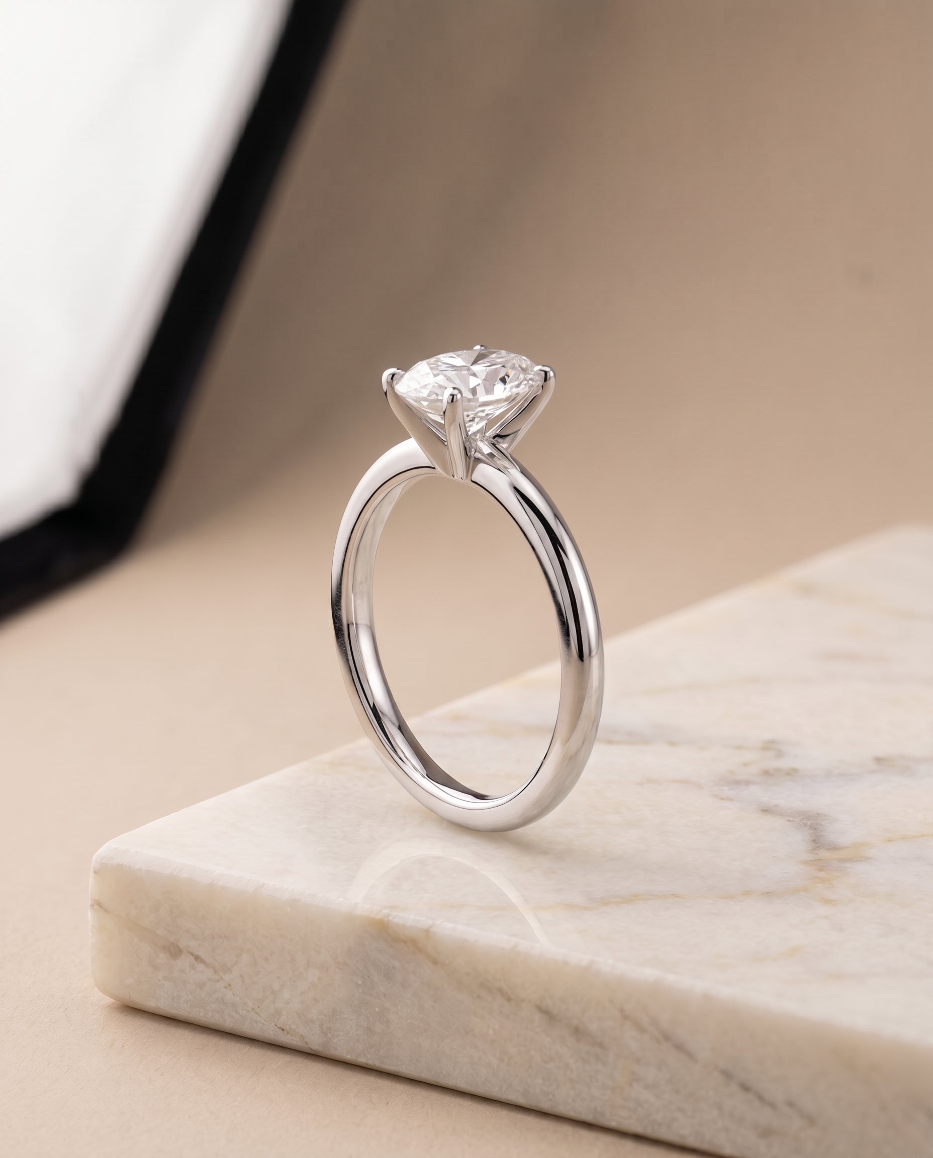 The Floria Comfort Fit Claw Prong Solitaire Oval Engagement Ring Setting in Platinum