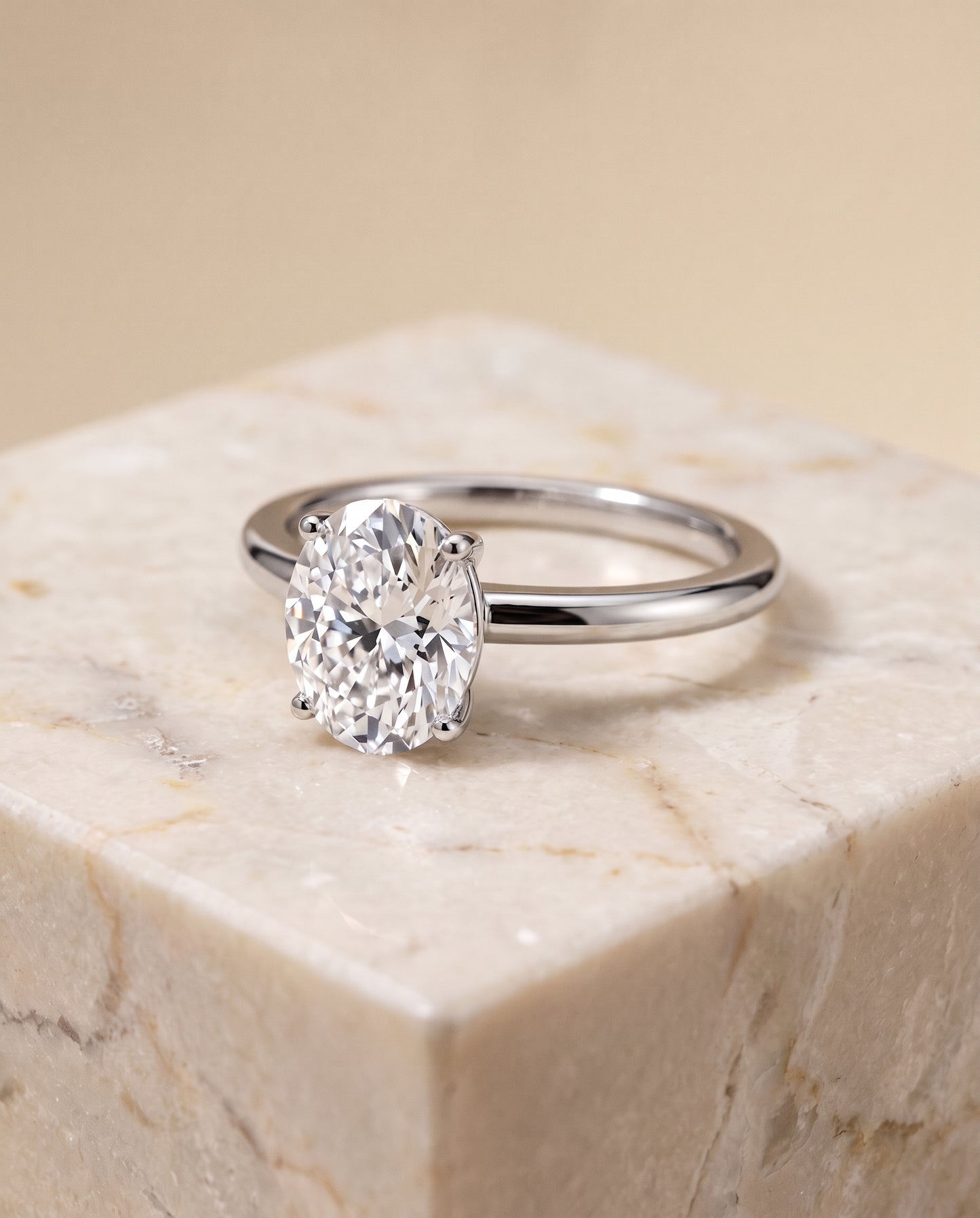The Floria Comfort Fit Claw Prong Solitaire Oval Engagement Ring Setting in Platinum