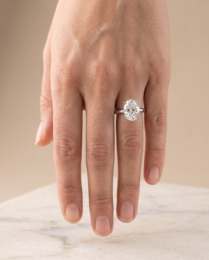 The Floria Comfort Fit Claw Prong Solitaire Oval Engagement Ring Setting in Platinum
