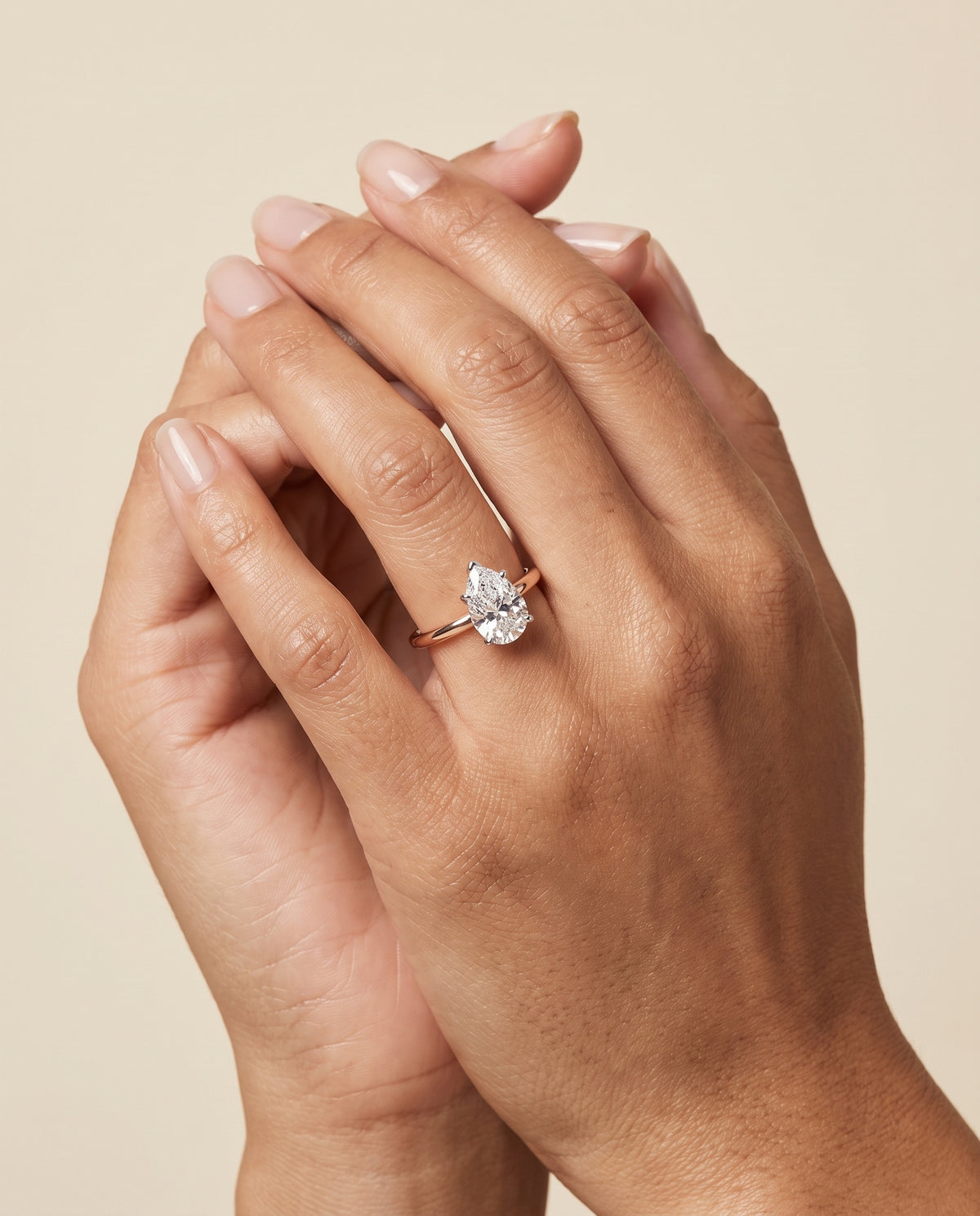 The Floria Comfort Fit Claw Prong Solitaire Pear Engagement Ring Setting in 14K Rose Gold