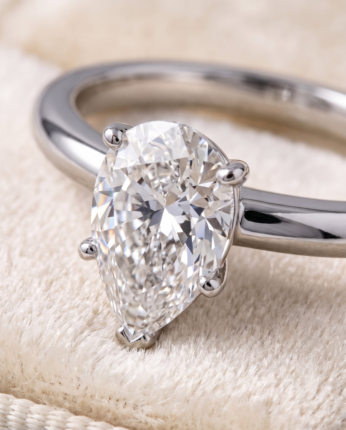 The Floria Comfort Fit Claw Prong Solitaire Pear Engagement Ring Setting in 18K White Gold