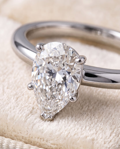 The Floria Comfort Fit Claw Prong Solitaire Pear Engagement Ring Setting in 18K White Gold