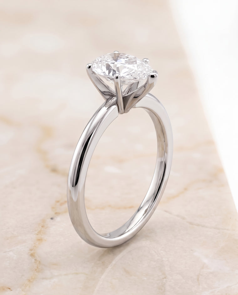 The Floria Comfort Fit Claw Prong Solitaire Pear Engagement Ring Setting in 18K White Gold