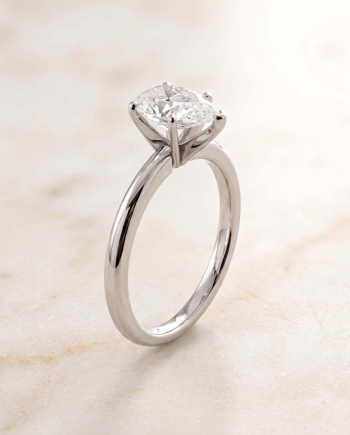 The Floria Comfort Fit Claw Prong Solitaire Pear Engagement Ring Setting in 18K White Gold