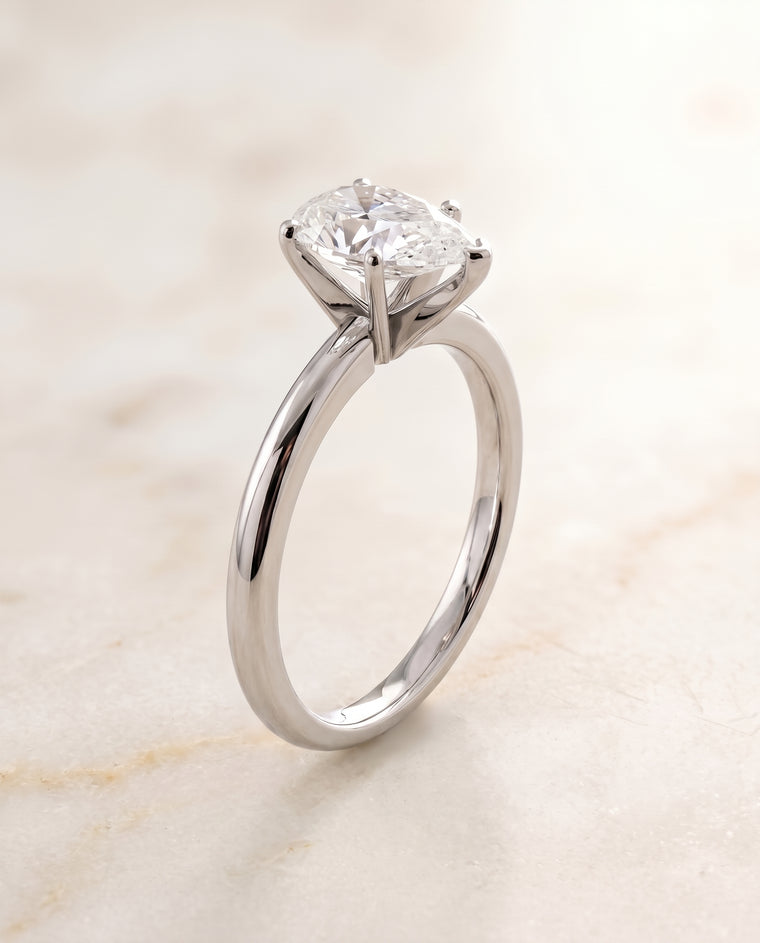 The Floria Comfort Fit Claw Prong Solitaire Pear Engagement Ring Setting in Platinum