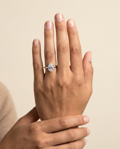 The Floria Comfort Fit Claw Prong Solitaire Pear Engagement Ring Setting in 18K White Gold