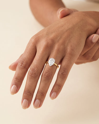 The Floria Comfort Fit Claw Prong Solitaire Pear Engagement Ring Setting in 18K Yellow Gold