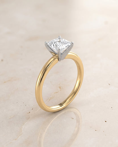 The Floria Comfort Fit Claw Prong Solitaire Princess Cut Engagement Ring Setting in 18K Yellow Gold