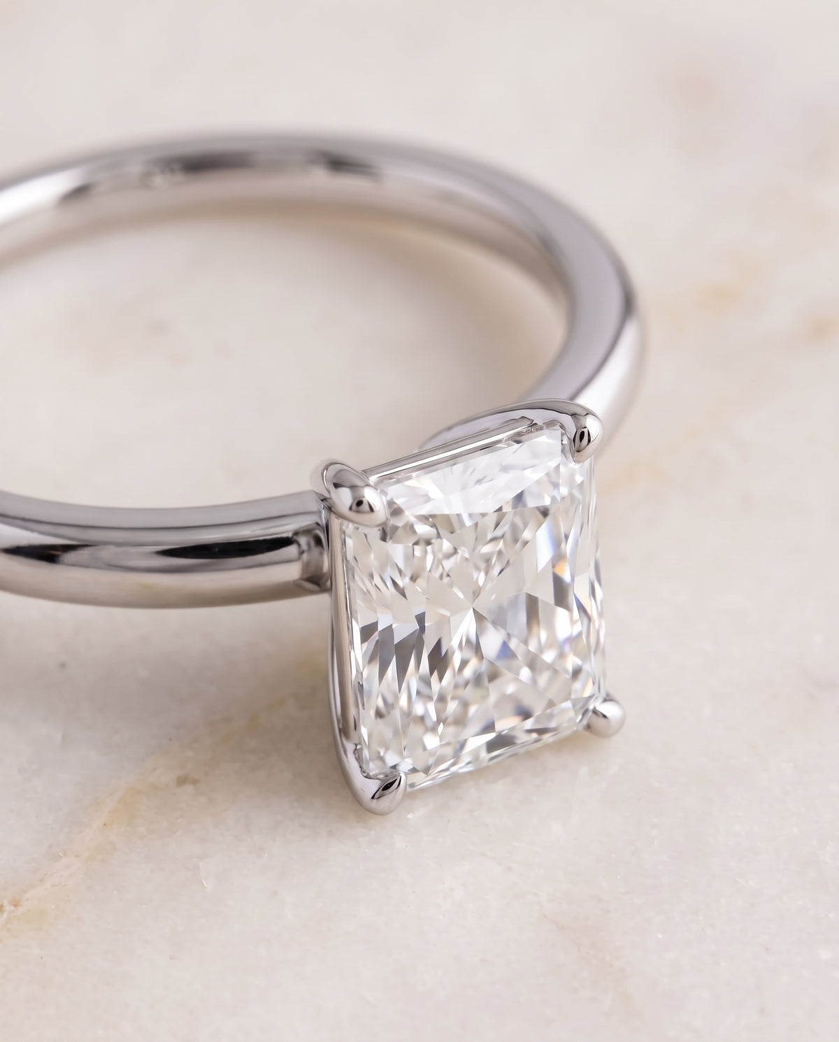 The Floria Comfort Fit Claw Prong Solitaire Radiant Cut Engagement Ring Setting in Platinum