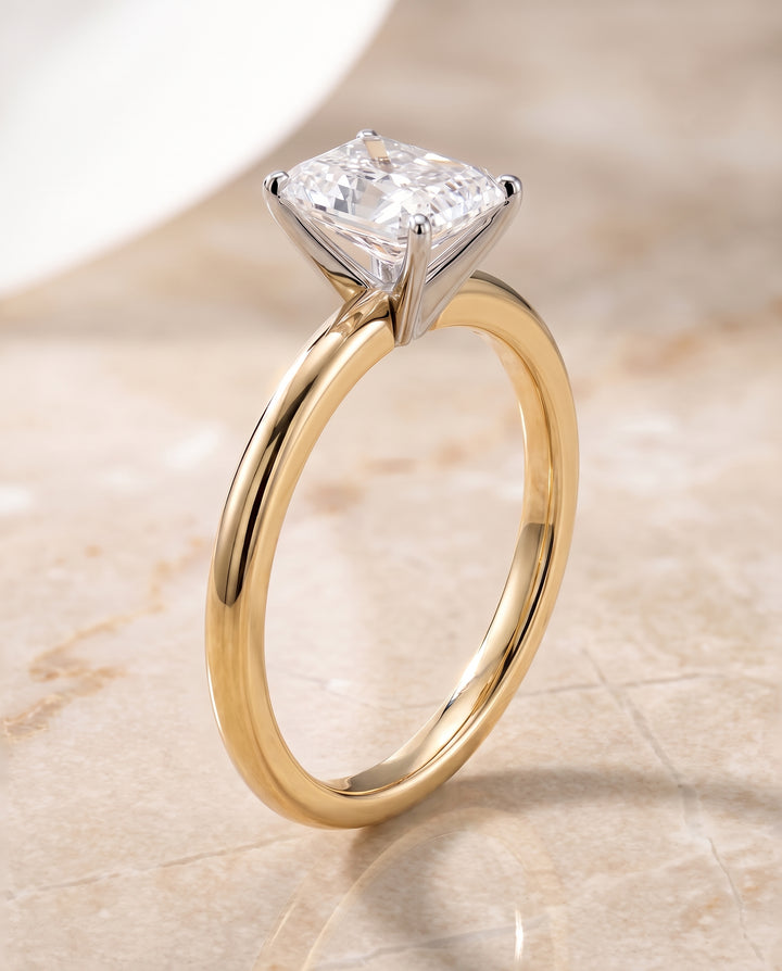 The Floria Comfort Fit Claw Prong Solitaire Radiant Cut Engagement Ring Setting in 18K Yellow Gold