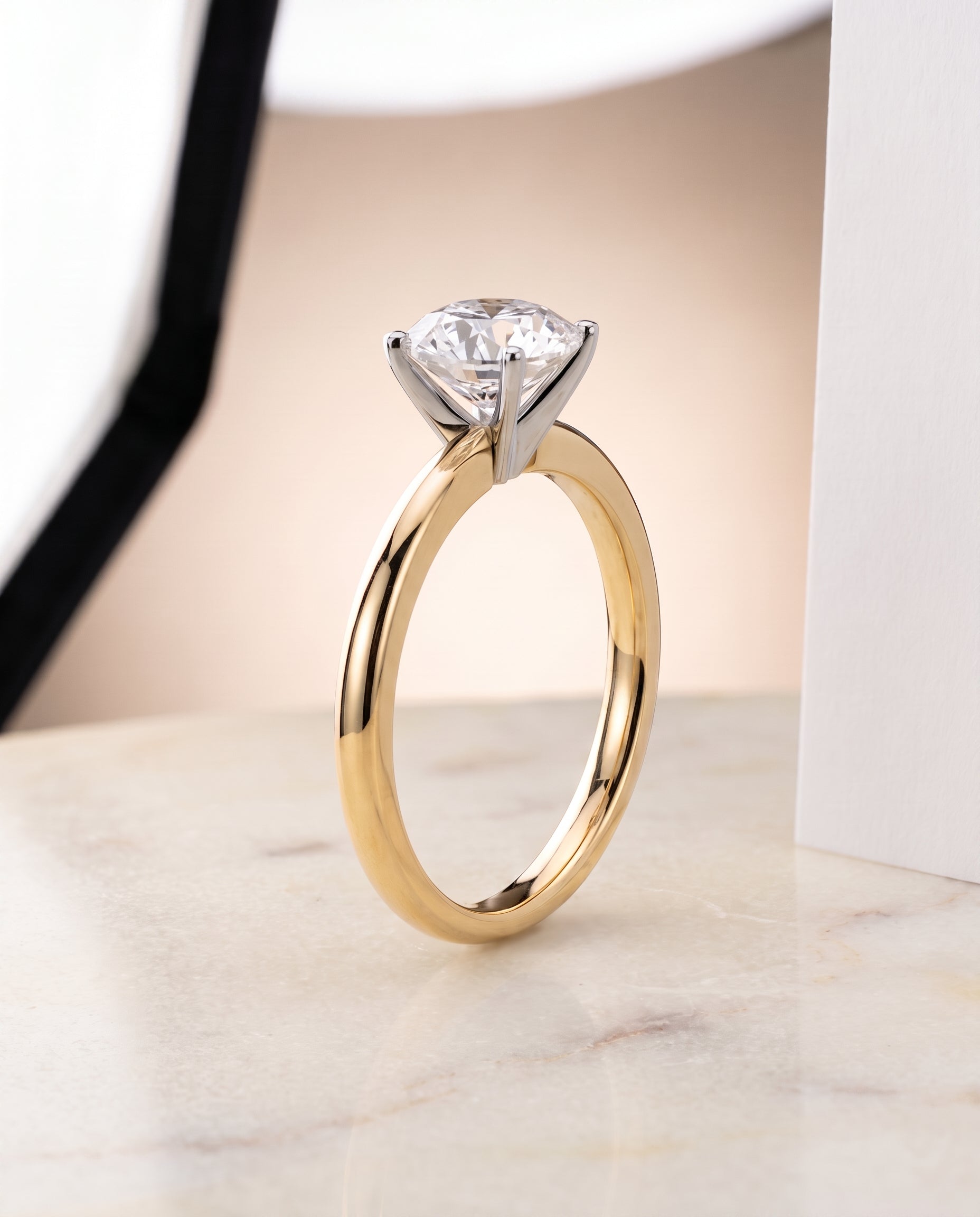 Comfort Fit Claw Prong Solitaire styling on The Floria round engagement ring setting | RockHer