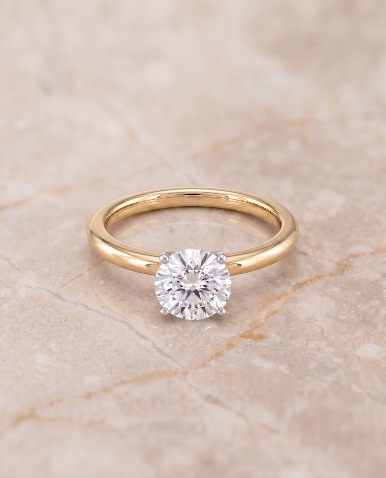 The Floria Comfort Fit Claw Prong Solitaire Round Engagement Ring Setting in 18K Yellow Gold