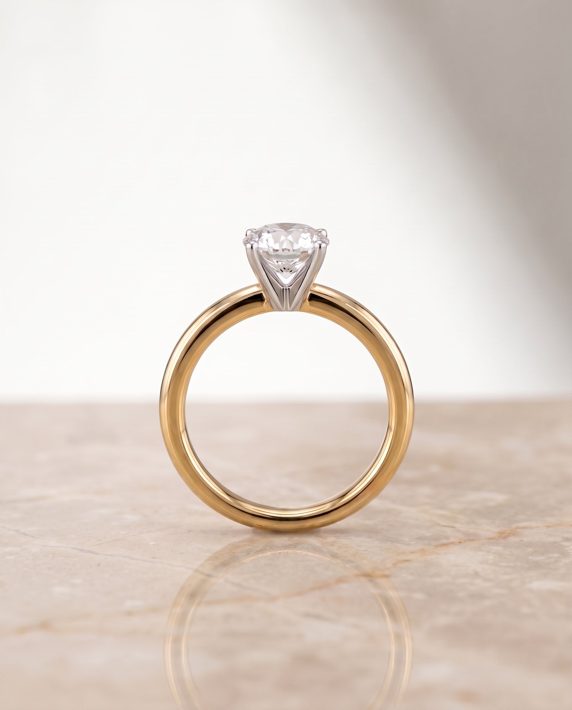 The Floria setting for round diamonds, made to order in 18K Yellow Gold | RockHer