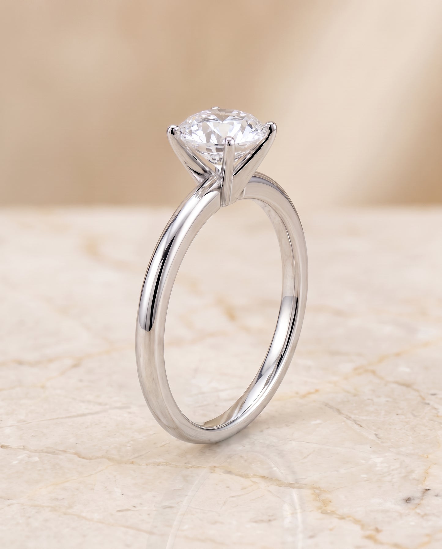 The Floria Comfort Fit Claw Prong Solitaire Round Engagement Ring Setting in Platinum