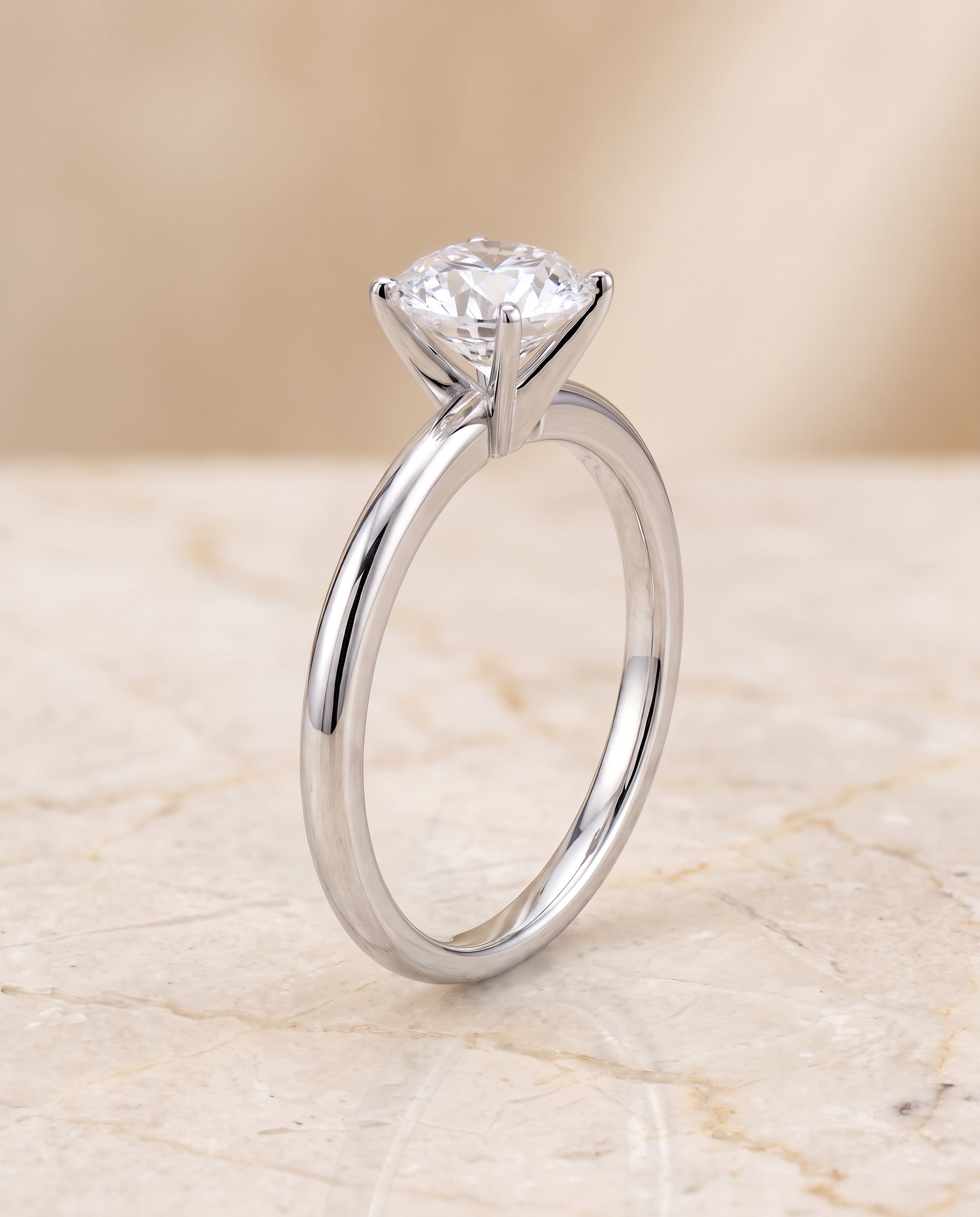 The Floria Comfort Fit Claw Prong Solitaire Round Engagement Ring Setting in 18K White Gold