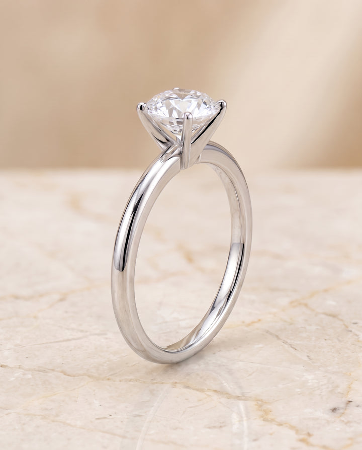 The Floria Comfort Fit Claw Prong Solitaire Round Engagement Ring Setting in Platinum