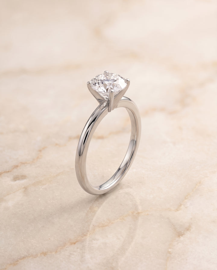 The Floria Comfort Fit Claw Prong Solitaire Round Engagement Ring Setting in Platinum