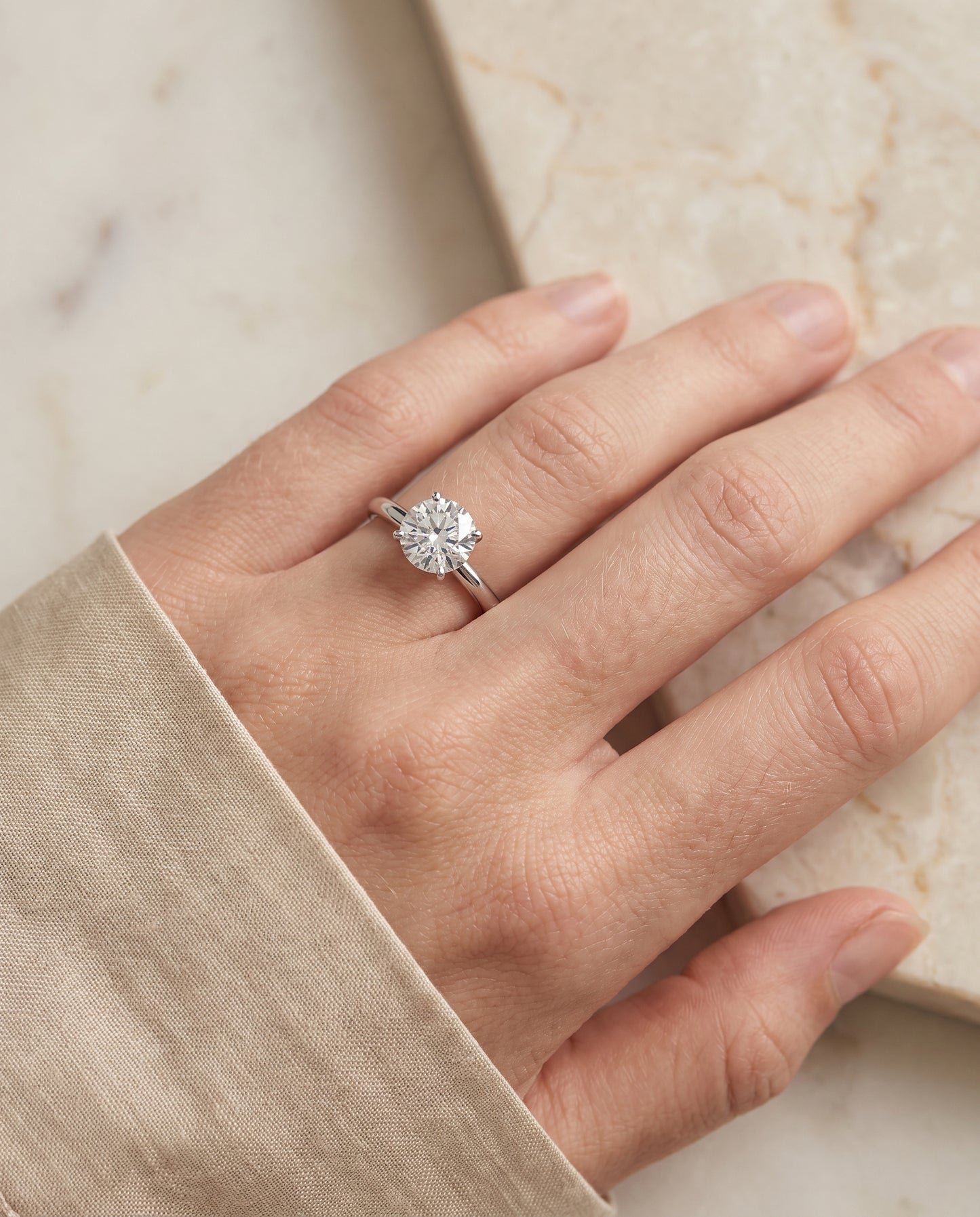 The Floria Comfort Fit Claw Prong Solitaire Round Engagement Ring Setting in Platinum