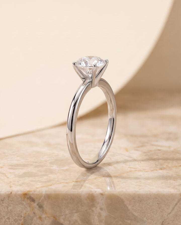 The Floria Comfort Fit Claw Prong Solitaire Round Engagement Ring Setting in Platinum