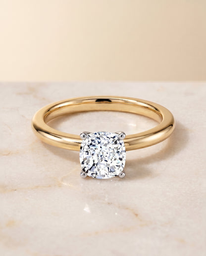 The Floria Comfort Fit Claw Prong Solitaire Cushion Cut Engagement Ring Setting in 18K Yellow Gold