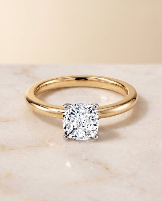 The Floria Solitaire Engagement Ring Setting for Cushion Diamonds in 18K Yellow Gold