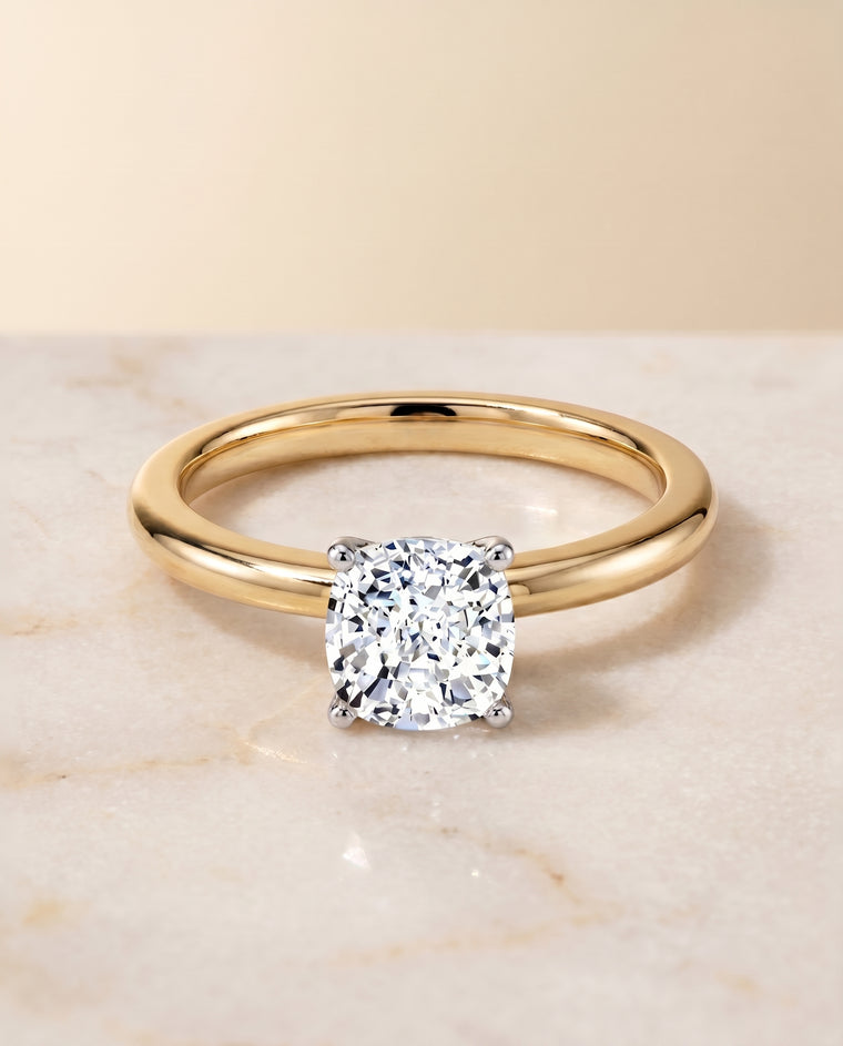 The Floria Comfort Fit Claw Prong Solitaire Cushion Cut Engagement Ring Setting in 18K Yellow Gold