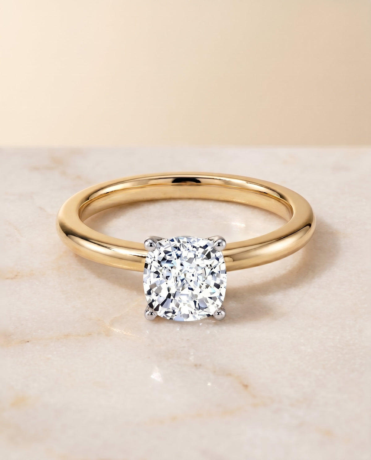 Floria Select Solitaire Cushion Cut Lab Diamond Engagement Ring in 18K Yellow Gold, shown on hand, angled | RockHer