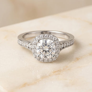 The Genesis Channel Pavé Halo Cushion Cut Engagement Ring Setting in 18K White Gold