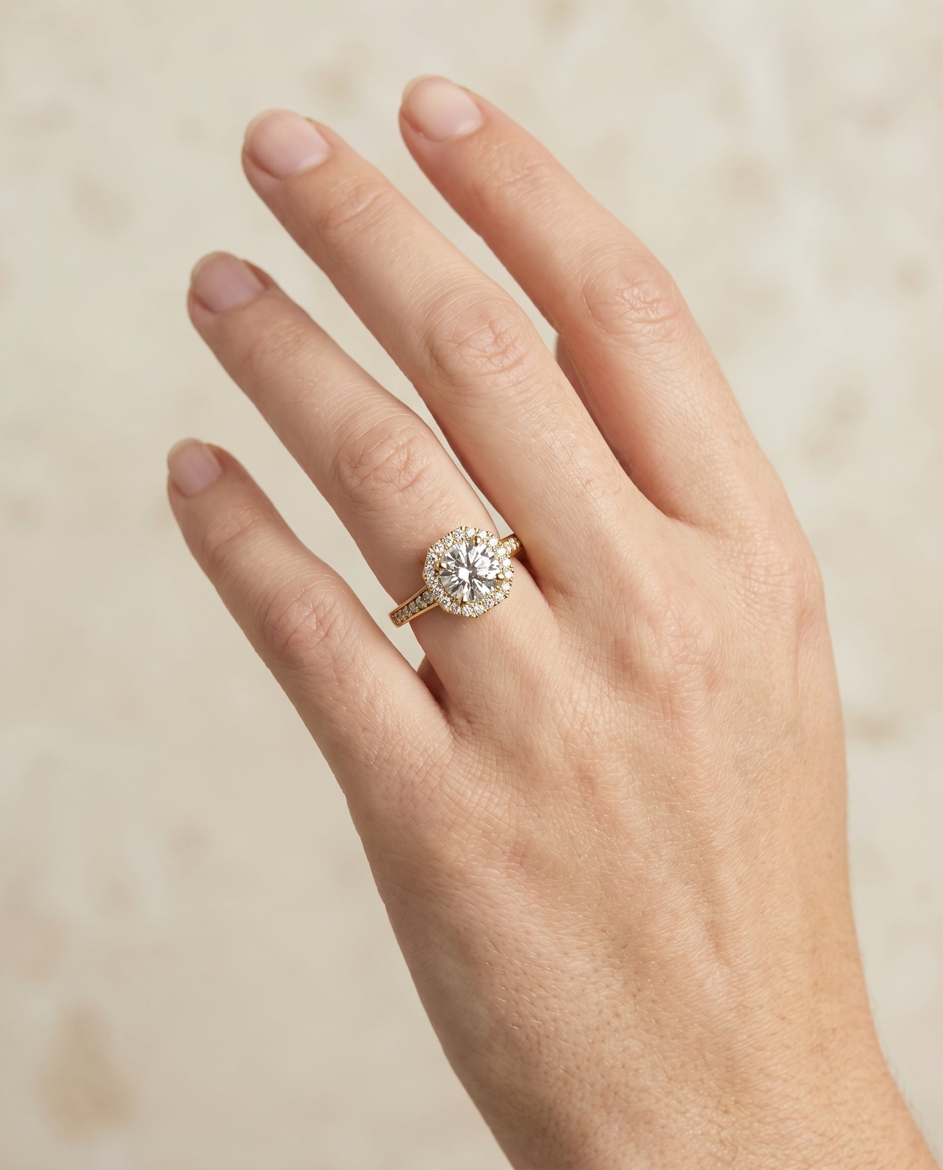 Genesis Select Halo Round Lab Diamond Engagement Ring in 18K Yellow Gold, shown on hand | RockHer