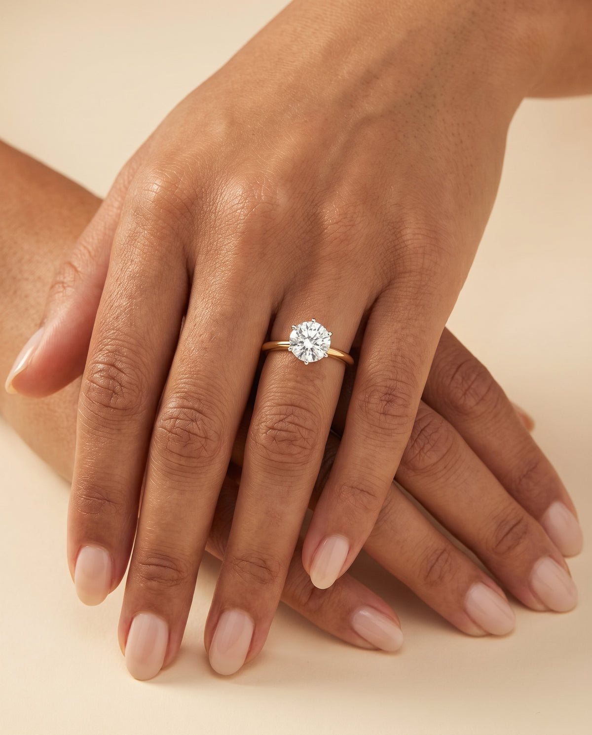The Giovanna Pinched Comfort Fit Claw Prong Solitaire Round Engagement Ring Setting in 18K Yellow Gold