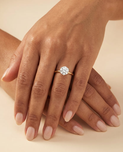 The Giovanna Pinched Comfort Fit Claw Prong Solitaire Round Engagement Ring Setting in 18K Yellow Gold