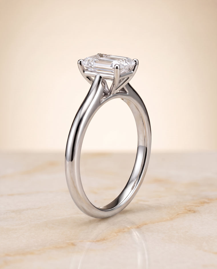 The Gladys Pinched Cathedral Solitaire Emerald Cut Engagement Ring Setting in 18K White Gold