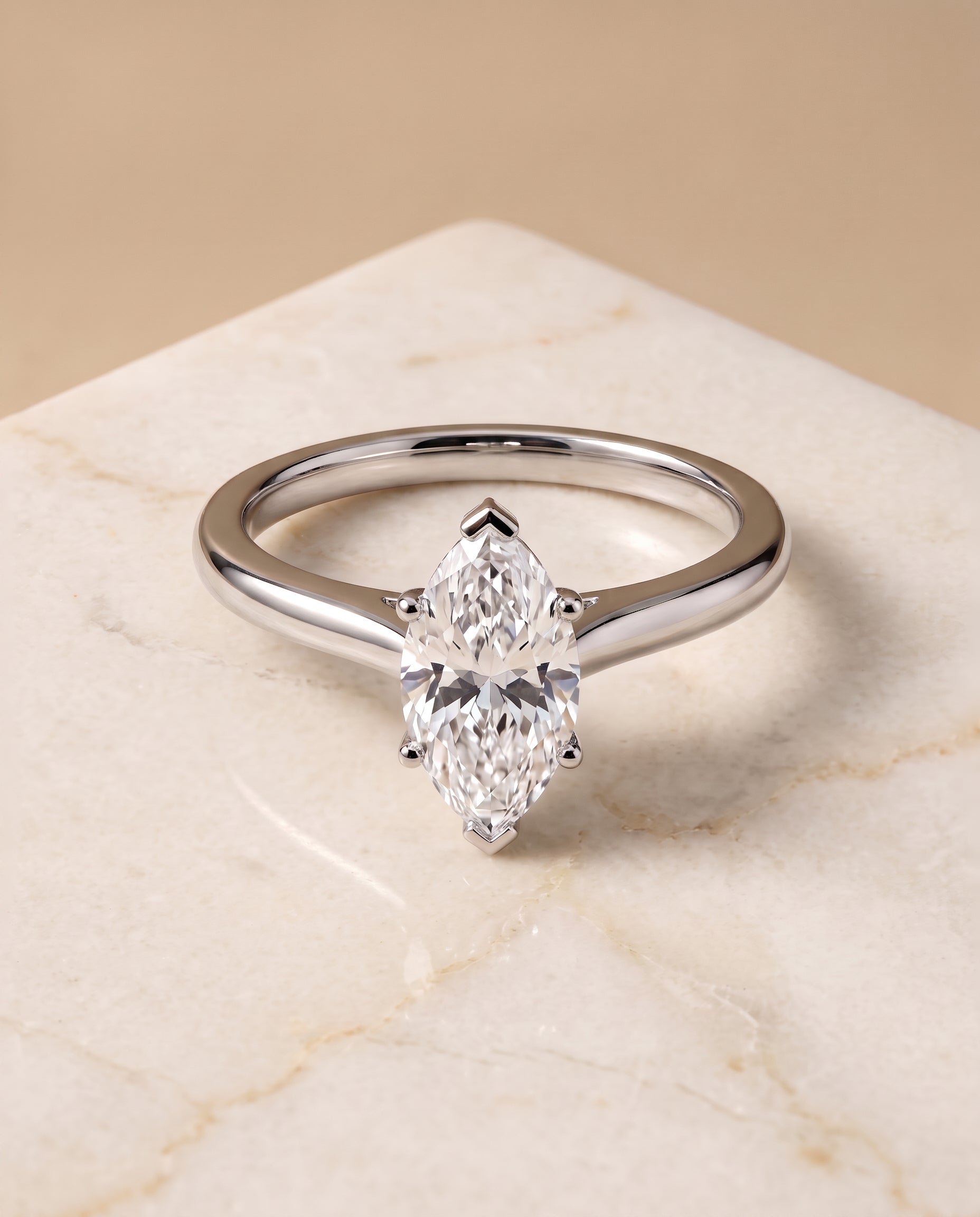 The Gladys Pinched Cathedral Solitaire Marquise Engagement Ring Setting in 18K White Gold