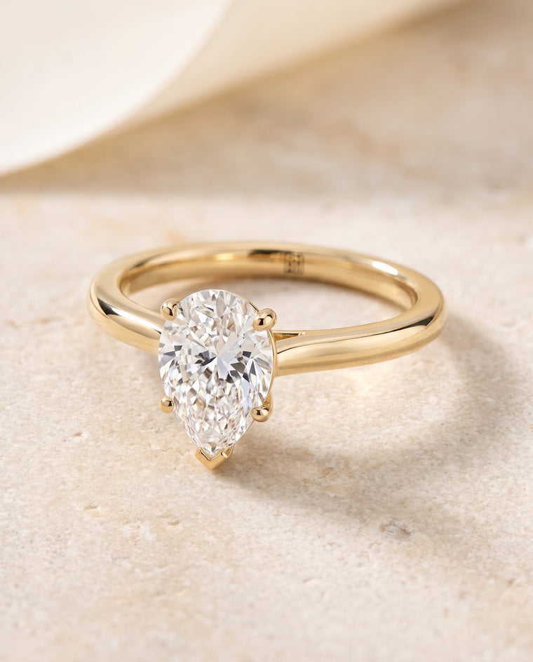 The Gladys Pinched Cathedral Solitaire Pear Engagement Ring Setting in 18K Yellow Gold