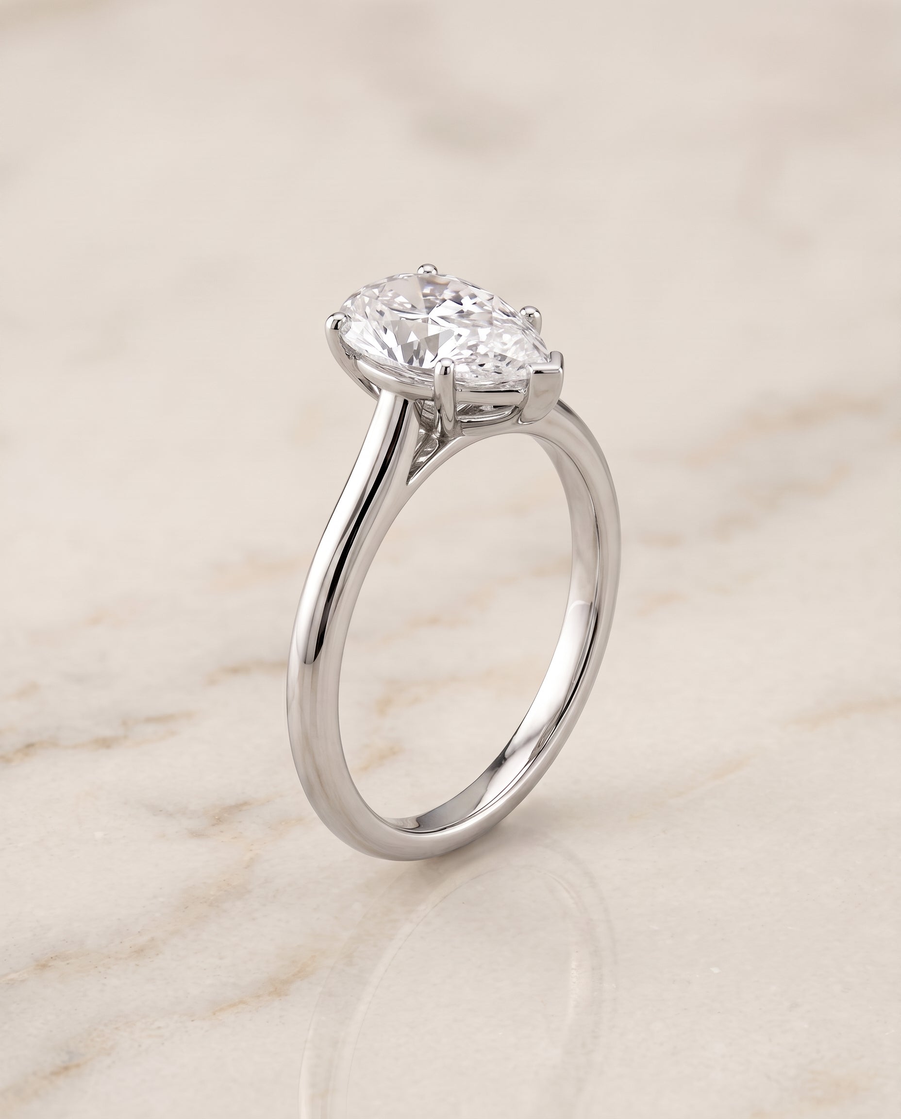 The Gladys Pinched Cathedral Solitaire Pear Engagement Ring Setting in 18K White Gold