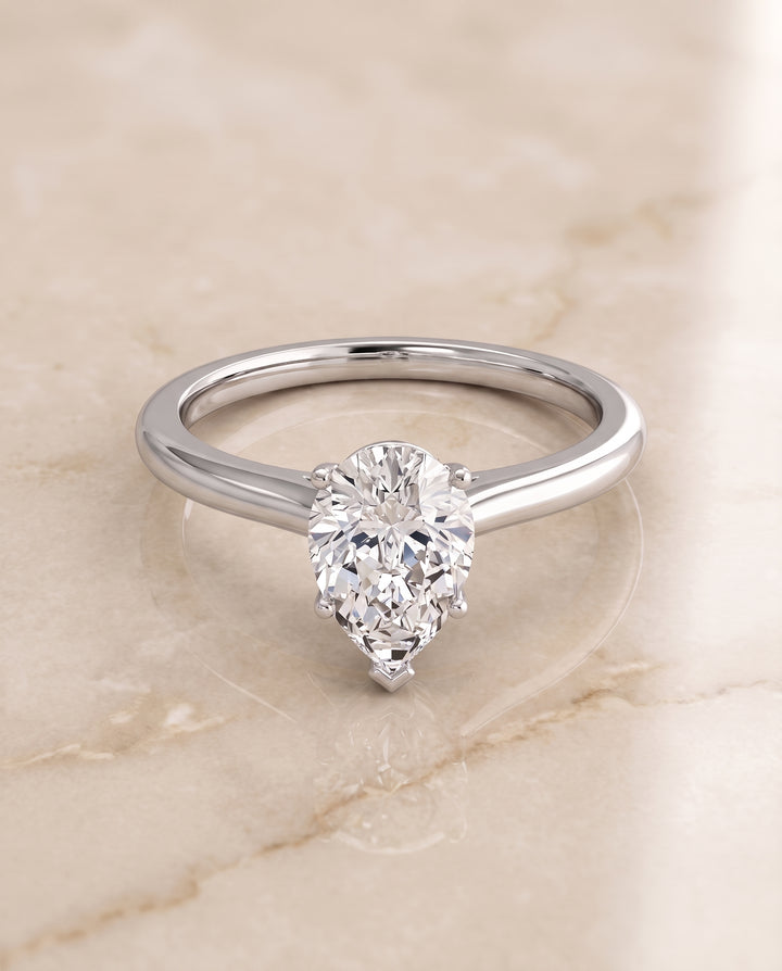 The Gladys Pinched Cathedral Solitaire Pear Engagement Ring Setting in 18K White Gold