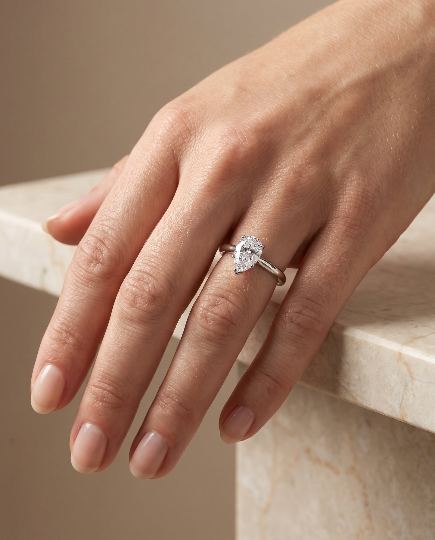 The Gladys Pinched Cathedral Solitaire Pear Engagement Ring Setting in 18K White Gold