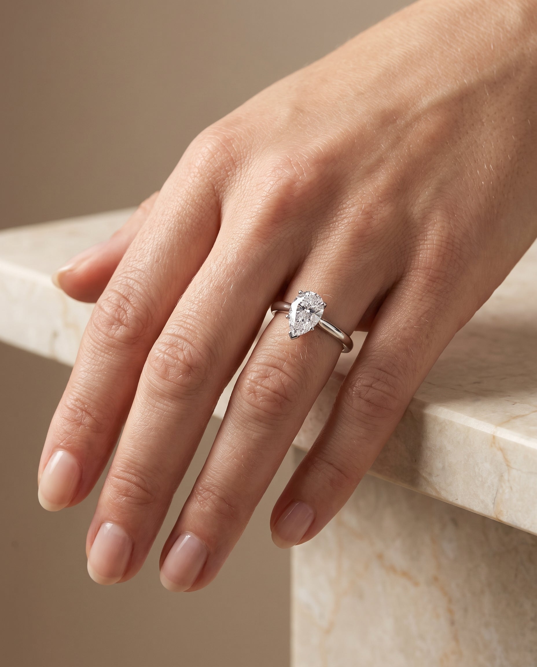 The Gladys Pinched Cathedral Solitaire Pear Engagement Ring Setting in 18K White Gold