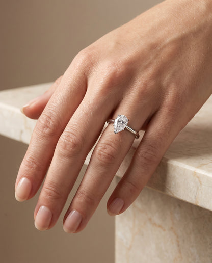 The Gladys Pinched Cathedral Solitaire Pear Engagement Ring Setting in 18K White Gold