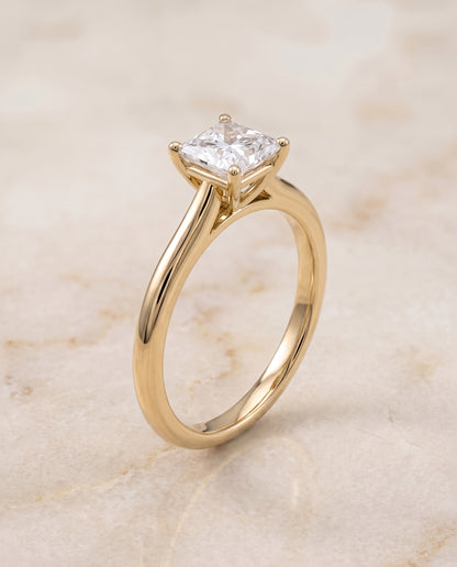 The Gladys Pinched Cathedral Solitaire Princess Cut Engagement Ring Setting in 18K Yellow Gold