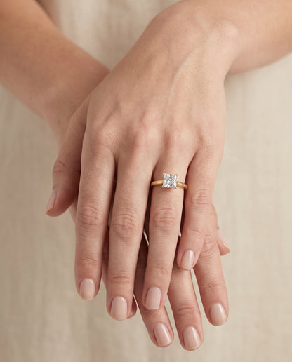 The Gladys Pinched Cathedral Solitaire Princess Cut Engagement Ring Setting in 18K Yellow Gold
