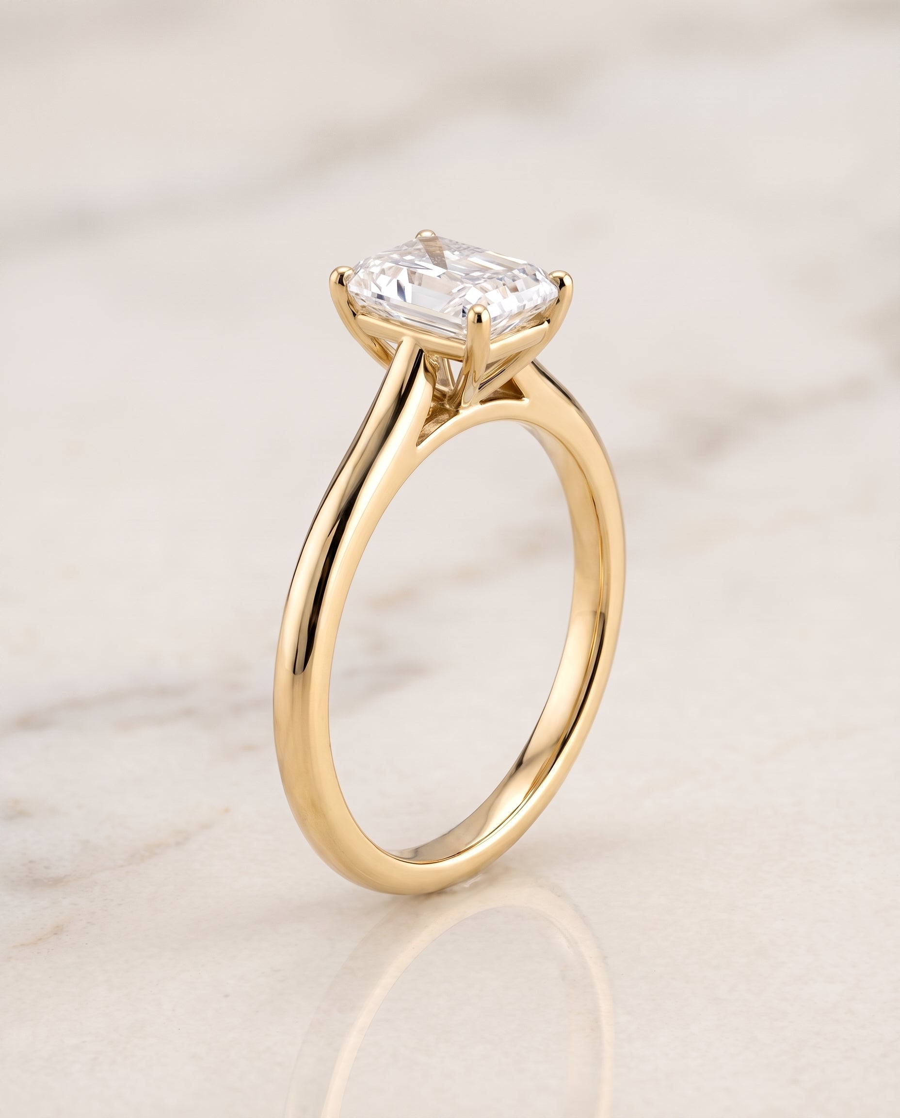 The Gladys Pinched Cathedral Solitaire Radiant Cut Engagement Ring Setting in 18K Yellow Gold