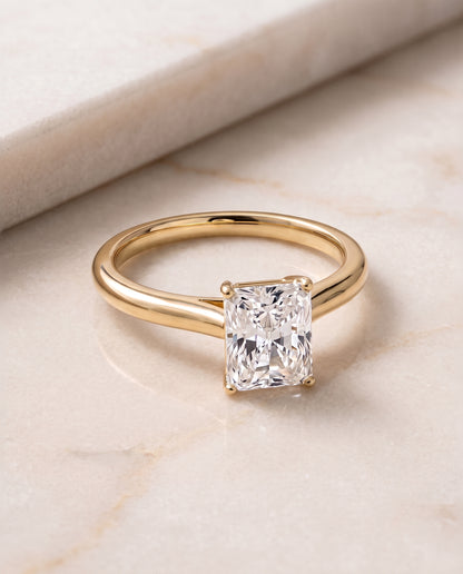 The Gladys Pinched Cathedral Solitaire Radiant Cut Engagement Ring Setting in 18K Yellow Gold