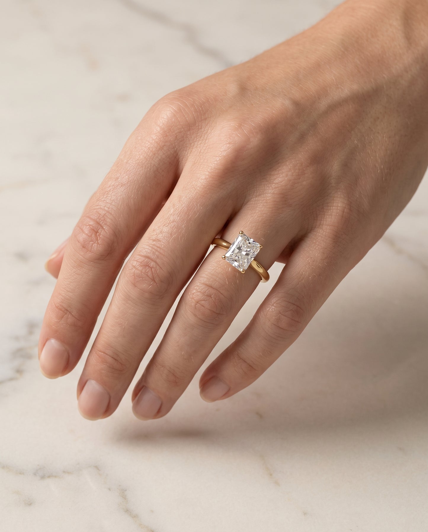 The Gladys Pinched Cathedral Solitaire Radiant Cut Engagement Ring Setting in 18K Yellow Gold