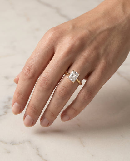 The Gladys Pinched Cathedral Solitaire Radiant Cut Engagement Ring Setting in 18K Yellow Gold
