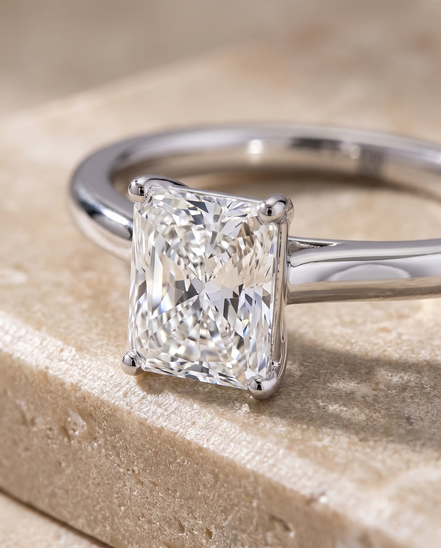 The Gladys Pinched Cathedral Solitaire Radiant Cut Engagement Ring Setting in 18K White Gold