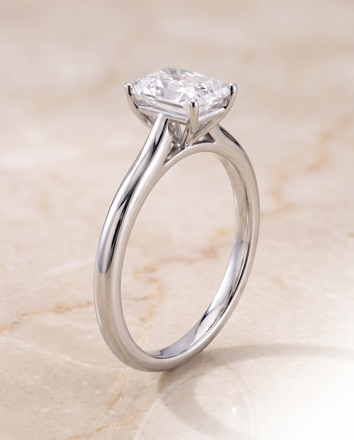 The Gladys Pinched Cathedral Solitaire Radiant Cut Engagement Ring Setting in 18K White Gold